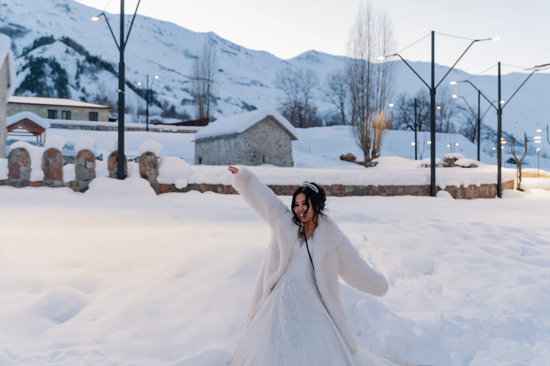 foreign couple at a wedding in the snowy mountains of Georgia